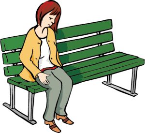 junge Frau sitzt einsam auf einer Parkbank